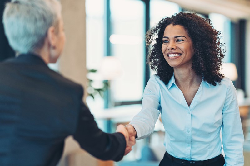 Employer_showing_appreciation_to_a_colleague_on_a_meeting