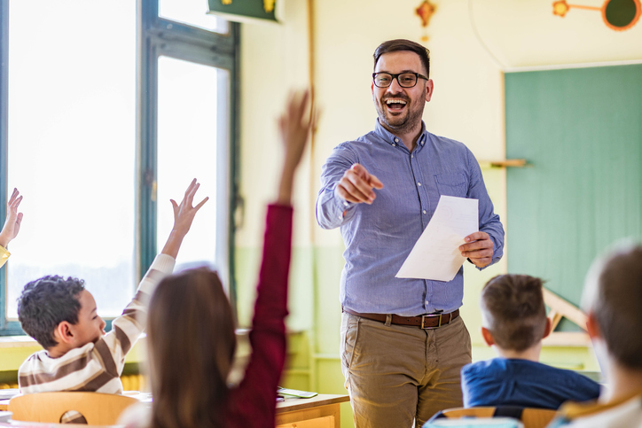 teacher in classroom educating students